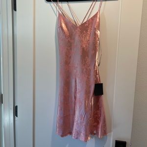 Lulu’s pink satin mini with floral print and crisscross straps